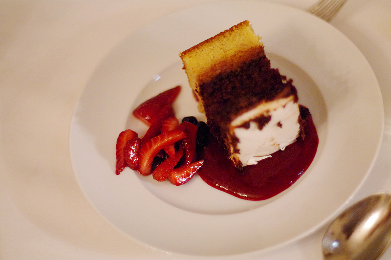 Wedding cake served with strawberries & coulis