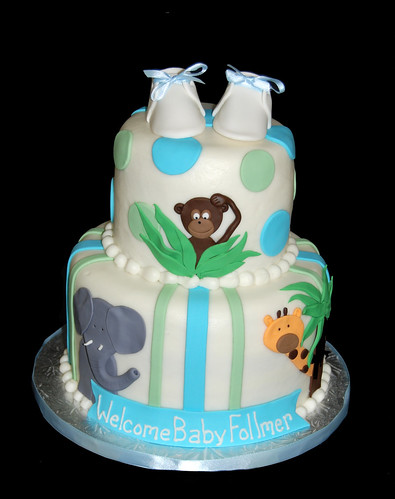 Elephant Monkey and Giraffe Jungle themed baby shower cake with baby shoes