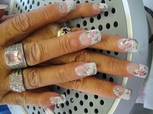 Nail art design each nail on her finger is different, so there are 5 designs on top of the acrylics