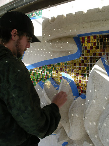 Recent graduate Drew Hutcheson works on detailing the mosaic during the phoenix face-lift project that took place this past June.  Courtesy of Fr. Tom Lucas 