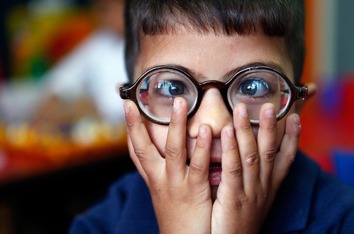 Daoud, a five-year-old visually impaired Palestinian boy, reacts to light after a teacher opened the window