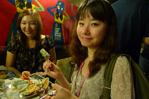 Miyonne eating, Tomoko in background
