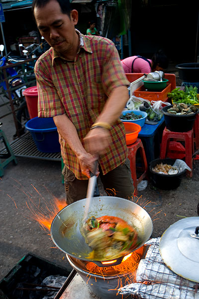 Frying up curry crab at Hat Yai's evening market