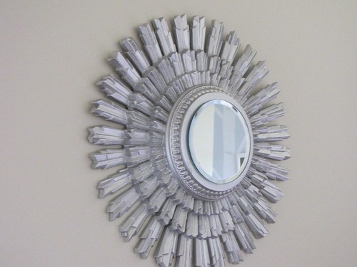 Wall hanging that I added a mirror to and spray painted silver