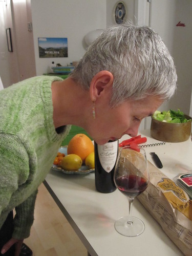 Mom gives the wine a snif test