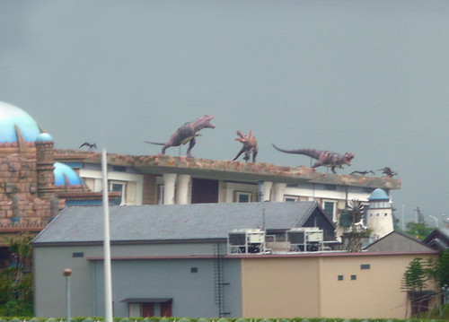 Pictures Of Dinosaurs Fighting. Dinosaurs fighting of the roof of an upsidedown building. Only in china!