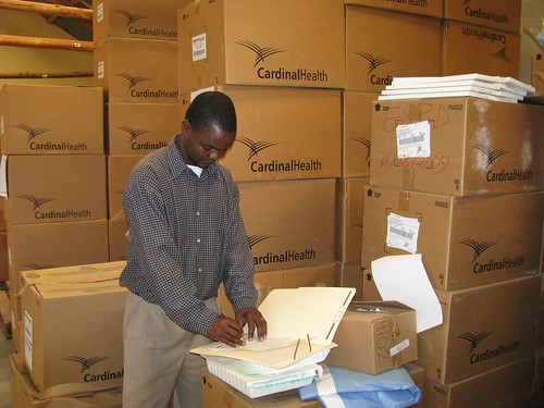 Wilson Tembo checks supplies for Namikango Maternity Clinic