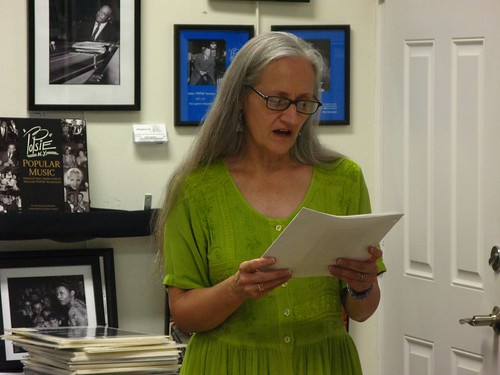Barbara Brenner recites some of her favorite poetry to the guests of the League.
