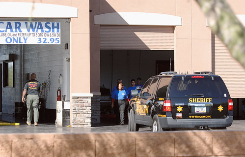 Workers are marched out of a carwash during Sheriff Arpaio's latest immigration raid - Photo: José Muñoz.