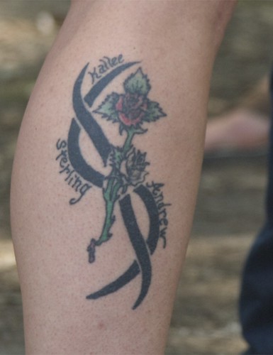  Flower and Tribal Leg Tattoo 