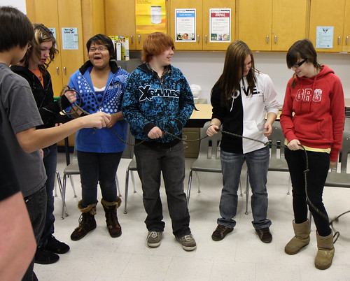 Grade 9 students trying to Untie the Knot at todays Character Education workshop.