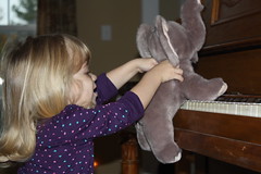 elephant takes a turn playing the "pian-yo"