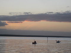 Girls kayaking in sunset