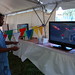 Rooney Armstead, Patient Care Technician playing video game at employee picnic