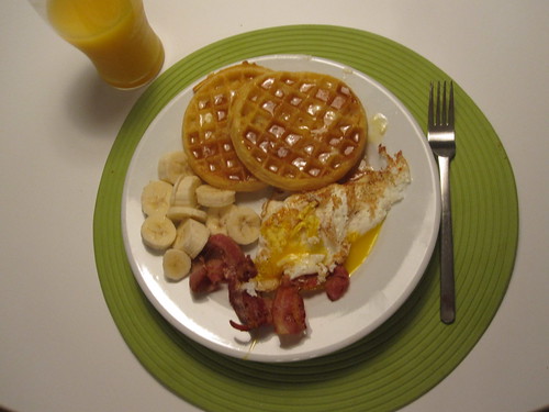 Waffles, bacon, eggs and banana slices, OJ