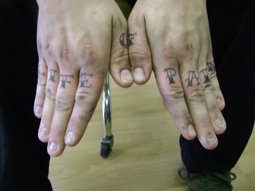 lettering tattoo on hands