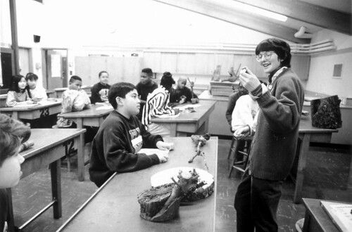 Teacher and students in classroom, circa 1990s