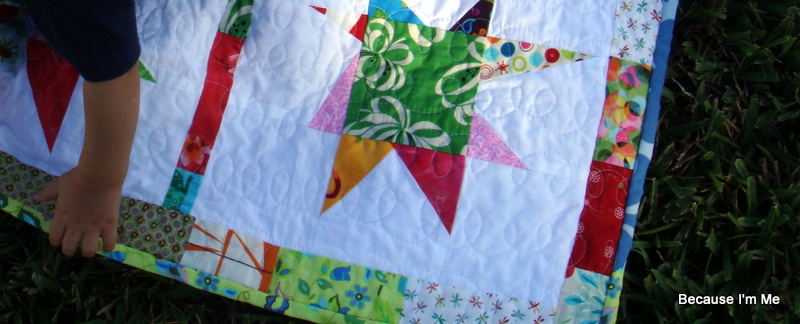 star quilt with adorable baby hand  :)