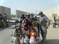 Unselfish Soldier: Aiirmen  with Iraqi Children