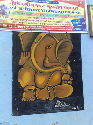 graffit of Ganesha, the Hindu Elephant God, beneath a Hindi banner...