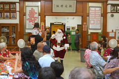 Santa coming into See Dai Doo hall