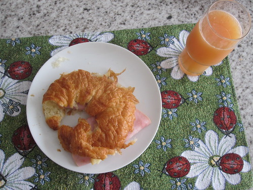 ham and cheese croissant with grapefruit juice