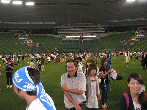 Fans celebrating on the field.