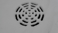 A sewer photographed during a snow storm. Skokie Illinois. December 2009.