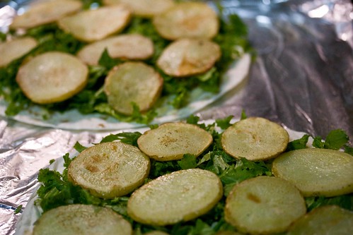 roasted potatoes and mustard greens on tortillas