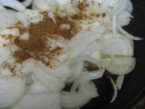 Sliced onions with a pinch of brown sugar