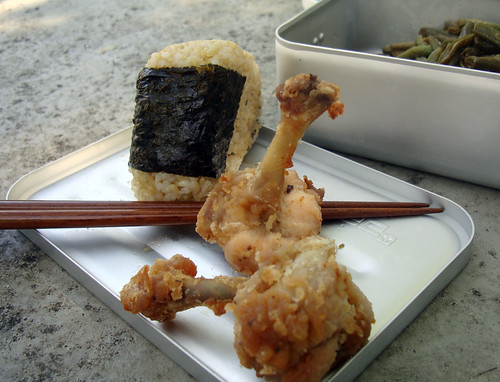 A road side picnic with onigiri and chicken lollipops