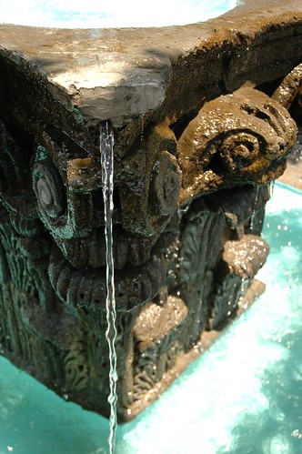 Water pouring over a classical stone fountain, turquoise, repaired end, column style, Guadalajara, Jalisco, Mexico by Wonderlane