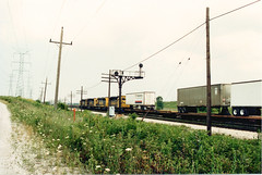 Eastbound Atchinson, Topeka & Santa Fe piggyback train passing through Nerska Junction. Chicago Illinois. May 1990.