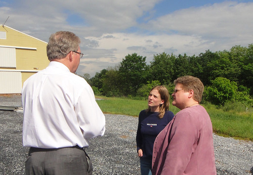 Thomas Williams, Pennsylvania Rural Development State Director, talks about the USDA Rural Energy for America Program with Roxanne Molnar, funding recipient (center) and Deputy Under Secretary for Rural Development Cheryl Cook.  REAP funding enabled Molnar Farms to install computer-controlled radiant heaters to reduce energy costs.  Cook and Williams toured the farm earlier this month.  