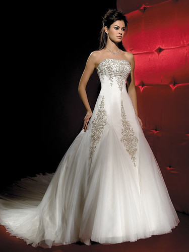 Strapless gown with embroidery and sequins.