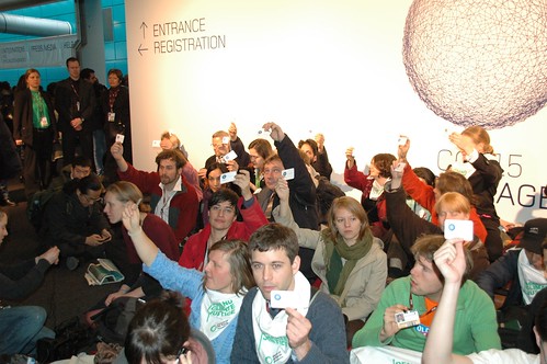 Friends of the Earth delegates stage sit-in at the Bella Center