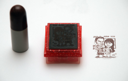 couple caricatures on rubber stamp + ink refill