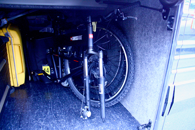 The new Montague Swissbike LX folds up and fits comfortably underneath the tour bus along with the other luggage. 