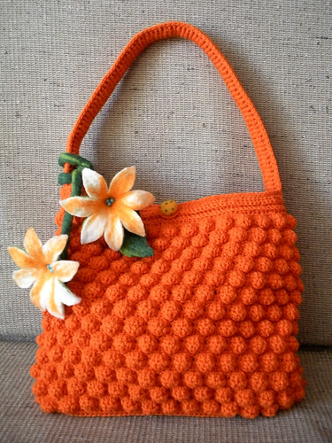 Orange crocheted purse with felted flowers