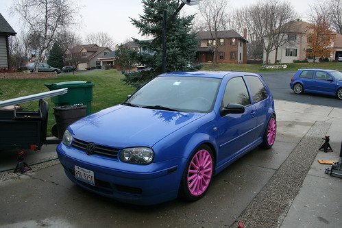 my girlfriend's car with pink wheels