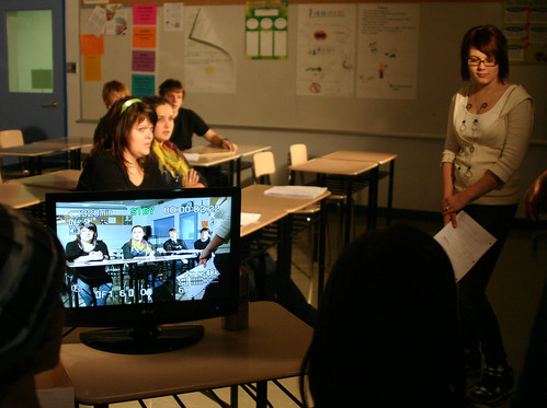 Directors observe on the video monitor as the actors go through their scene.