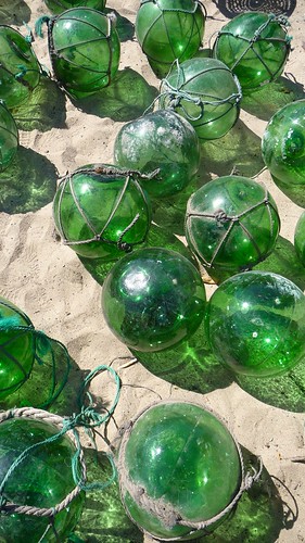 Japanese fishing net floaters in the sandpit