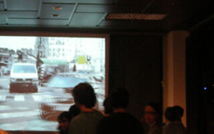 A photograph of a Pecha Kucha-style presentation in action