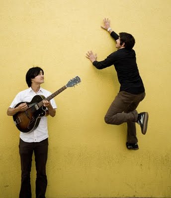 The Dodos once again in front of a wall doing stuff.