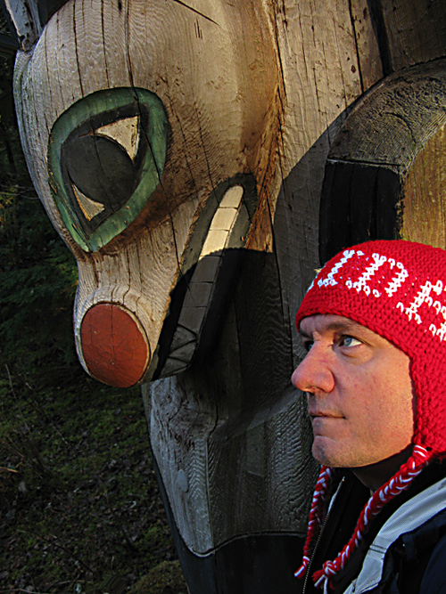 Otilius self portrait with totem pole, Kasaan Totem Park, Kasaan, Alaska