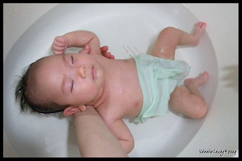 Snoozing in her bathtub