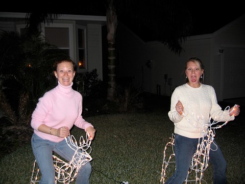 My sister, Ginny, and me riding reindeer at my parents house (2008)
