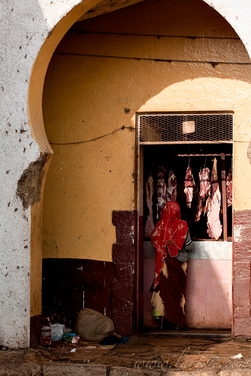 At the Butcher's (Woman in Street #4), Harar, Ethiopia, 2009