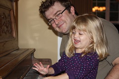 Catie playing piano with Daddy