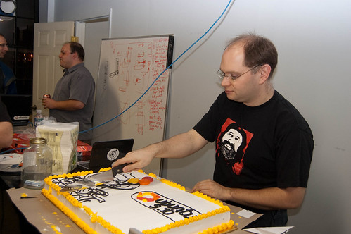 Cutting the cake at the Karmic release party